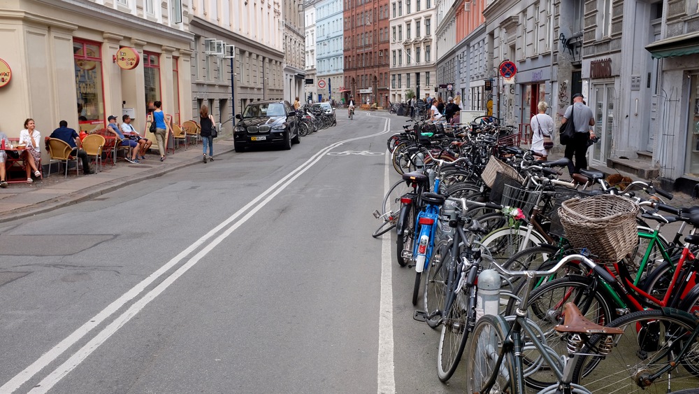 A typical Copenhagen street, full of bikes. How can there be some many bikes?